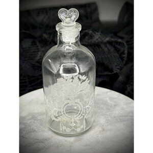 Small vintage etched glass bottle